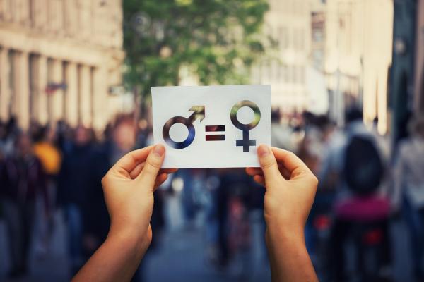 photo of male and female signs held up
