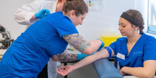 health students practice on each other
