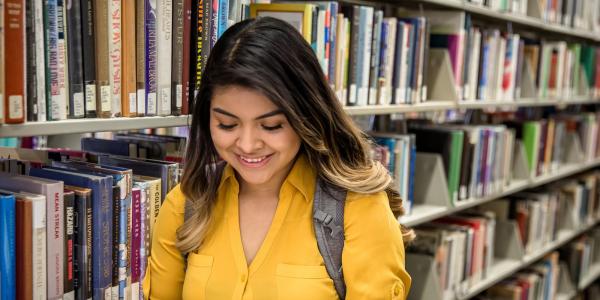 Photo of student reading book