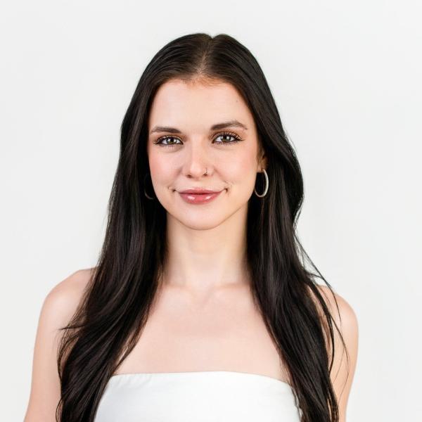 Headshot of Kyra on a white background