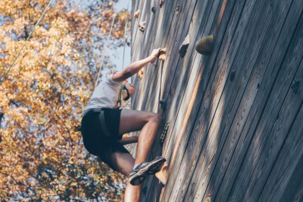 person climbing a wall