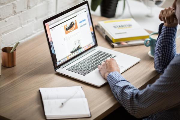 person writing with computer