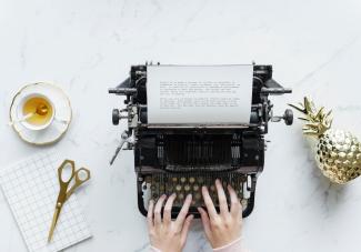 typewriter and tea cup